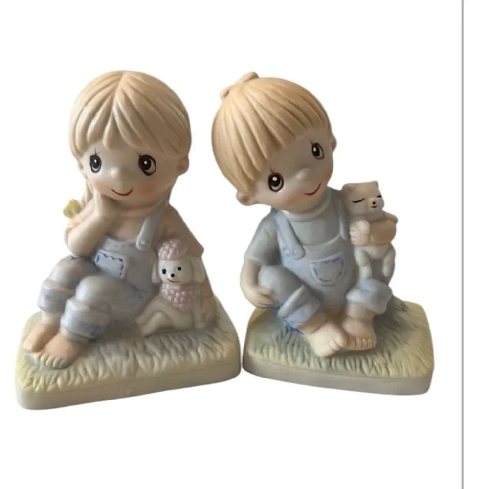 Vintage Boy & Girl porcelain sitting figurines EVC no chips cracks or fading